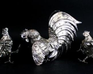 21 3 Silverplate Roosters Pair of silverplate fighting roosters, each approximately 7 3/4"L x 5"H; large rooster 11"L x 7 3/4". All unmarked