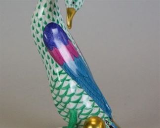41 Herend Fishnet Green Goose With Golden Egg Hand painted porcelain figurine Goose With Golden Egg. 4 3/4"W x 7 1/2"H. With Herend Hungary Handpainted mark and incised Herend 5936 on underside.