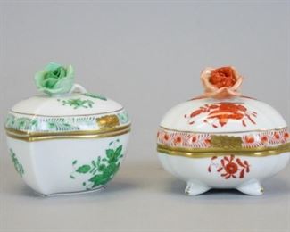 44 2 Herend Chinese Bouquet Boxes 2 hand painted Herend porcelain lidded boxes in the Chinese Bouquet pattern. Both with rose finials. Square box in rust 2 3/4"L x 3"H; heart-shaped box in green 3"L x 3"H. Minor flake on green finial. Both with Herend Hungary Handpainted marks on underside