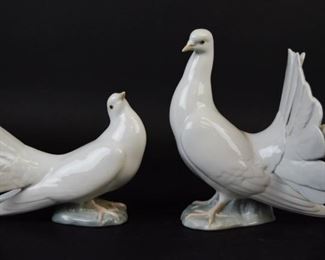51 2 Lladro Dove Porcelain Figurines 2 Lladro dove porcelain figurines. 7 3/4"H x 7"L and 5 1/4"H x 7"L. Both marked Lladro on the underside.