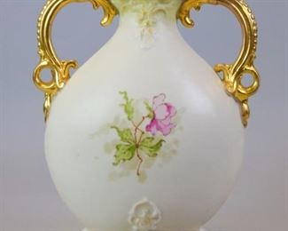 50 Royal Worcester Style 2 Handled Vase Porcelain vase with hand painted floral decoration and gilt handles. In the style of Royal Worcester, illegible mark to the underside. 12"H