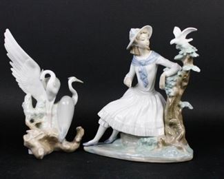 53 2 Nao Porcelain Figurines 2 Nao by Lladro porcelain figurines. Resting Herons, 5"W x 10"H; Girl With Dove, 8 1/2"W x 10"H.