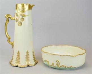 56 Limoges Porcelain Tankard & Serving Bowl 2 pieces of hand painted French porcelain. Martial Redon serving bowl, with floral decoration and gilt painted rim, marked on the underside MR France, 3"H x 9"-diameter; Elite Works Limoges tankard, with gilt painted decoration, marked on the underside Elite France and Elite Works Limoges France, 12"H