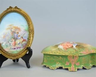 65 Limoges Porcelain Plaque & Dresser Box Hand painted Bawo & Dotter Limoges porcelain dresser box with a scene of a young couple on the lid, artist signed Dubos, 9"L x 5 1/2"W x 4 1/4"H; and a hand painted porcelain plaque, marked Aeon C. Limoges France, 7 1/4" x 5". Frame cracked, plaque separated from frame.