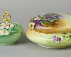 69 Grouping of Four Limoges Porcelain Boxes Elite Limoges hand painted pansy motif dresser box, 4"T x 8 1/2"W, no chips; T&V Limoges artist initialed gilt and floral hand painted small dresser box, 2 3/4"T x 5"W, no chips; T&V Limoges France gilt and floral hand painted dresser box with handled lid, 5"T x 4 3/4"W, no chips; T&V Limoges gilt and hand painted hair receiver box, 2 3/4"T x 4"W, no chips