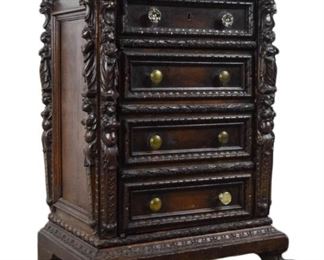 71 19th Century Jacobean Style Cabinet 1 drawer over cabinet with faux 3 drawer front. Clawfeet and figural carvings. 23 1/2"W x 15 1/2"D x 32"H. Wear and scratches to top, chips throughout.