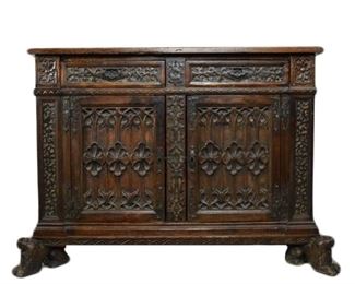 72 18th Century Carved Walnut Italian Cabinet With figural lion feet. Two drawers over a cabinet. 47"L x 17 1/2"D x 36"H. Wear and scratches to top, minor wear throughout consistent with age.