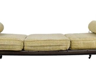 76 Wrought Iron Day Bed Neo Classical design. Lyre shape sides with foliate decorations. On iron casters. Wear though out, some bolts replaced. 75 1/2" x 35 1/2" x 26"