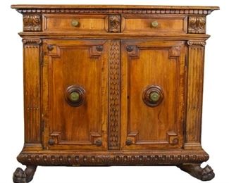 75 18th Century Continental Carved Cabinet Two drawers over two drawers. Acanthus leaf carvings. Fluted column pilasters. Paw feet. Damage and repairs throughout. 52" x 45" x 22"
