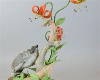 96 Boehm Porcelain Bird Group Eastern Kingbird Limited edition porcelain bird and flower group, Eastern Kingbird. Numbered 60 and dated 1975 with Edward Marshall Boehm mark on the underside, signed Boehm on the base. Flower detached, leaf detached, one leaf missing near base, one flower loose. 18 1/4"H x 12"W.