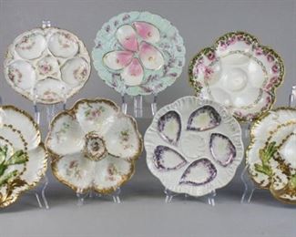 137 7 Hand Painted Continental Porcelain Oyster Plates 7 hand painted oyster plates. A pair, with seaweed decoration, marked CFH GDM France; Limoges, with cherub decoration in center; Haviland & Co. for the Van Heusen Charles Co.; Theodore Haviland; Rudolstadt; and 1 unmarked. Chip on rim of Rudolstadt, line in unmarked plate, rim chip on Theo. Haviland, rim chip on Haviland & Co. Pair each 8 3/4"-diameter