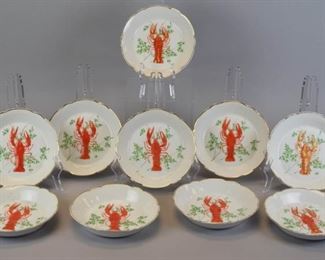144 Set of 10 KPM Lobster Dishes 10 porcelain dishes with hand painted lobster and herb decorated centers and gilt rims. All with blue KPM stamps on the underside. Each 1 1/4"H x 7 1/4"-diameter. Some minor paint losses to decoration.