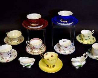 147 Grouping of Cups, Saucers, Sugar & Creamer 2 Hutschenreuther porcelain silver overlay cups, 4 1/4" diameter, saucers, 6 1/4" diameter and small plates, 7 1/2" diameter, in blue and red; Franz William Ho strawberry motif cup and saucer; Shelley yellow with gold tone trim cup and saucer; Shelley Rose Pansy Forget Me Not cup and saucer; Royal Standard footed cup and saucer; Tirschenreuth Bavarian porcelain cup and saucer; Aynsley bone china Florida pattern cup and saucer; Royal Chelsea bone china cup and saucer; Hammersley Lily of the Valley bone china creamer and sugar dish set,