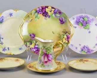 148 Continental Porcelain Grouping 11 pieces of German and French hand painted porcelain. Haviland Limoges plate with purple flowers, 9 3/4"-diameter; T&V Limoges (Tressemanes & Vogt) two handled plate, artist initialed and dated 1903, 11"-diameter; Haviland plate, signed C. Durflinger, 8 3/4"-diameter; T&V for Higgins & Seiter NY plate, 9 1/2"-diameter; German plate with reticulated rim, artist signed A.L Pease, 9 3/4"-diameter; set of 5 unmarked bread & butter plates with acorn decoration, each 6 1/2"-diameter; T&V creamer, 5"H
