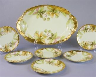 156 Limoges Platter and Matching Plates Hand painted gilt and leaf motif platter marked Bawo & Dotter Elite Works Limoges France, 17"L x 11"W, some wear and minor scratches on paint from wear, no chips; six hand painted gilt and leaf motif plates marked Bawo & Dotter Elite Works Limoges France, 7" diameter, some wear and minor scratches on paint from wear, no chips
