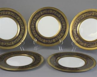 159 Set of 5 Royal Worcester for Ovington Bros. Plates Set of 6 porcelain service plates with white centers and cobalt & gilt decorated rims. All marked on the underside Royal Worcester Made in England, Ovington Bros. Co. New York and No. 651926. Each 10 3/4"-diameter