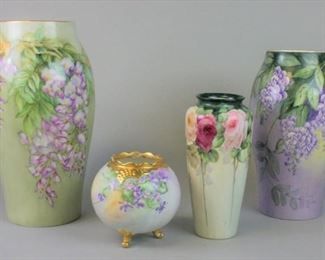 168 Grouping of Four Porcelain Vases Lot includes hand painted gilt and green floral motif vase with T&V Limoges mark and artist's signature, 13"T x 7 1/2W, no chips; hand painted gilt and lavender floral motif vase with T&V Limoges mark, 11"T x 7"W, no chips; hand painted rose motif vase with T&V Limoges mark 8 1/2"T x 4 1/2"W, no chips; hand painted gilt and floral motif round footed vase with Vienna Austria mark, 5"T x 6"W, no chips.