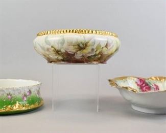 173 3 Continental Porcelain Serving Bowls All hand painted. Signed T&V Limoges (Tressemanes & Vogt) with pink flowers over green and gilt, 2 3/4"H x 8"-diameter; T&V Limoges bowl with floral decoration and serrated gilt rim, artist initialed, 3 1/2"H x 9 1/2"-diameter; serving bowl with pink flowers and gilt rim, marked illegibly on the underside, 3"H x 10 1/2"-diameter