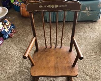 Antique children’s rocking chair with music box