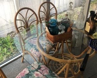Glass and wicker table and 4 chairs excellent condition!