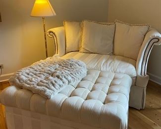 Plunket oversized chair with nailhead trim and tufted ottoman. Chair measures 61"W x 40"D. Ottoman has two pull-out cocktail trays. It measures 43"W x 31"D. Photo 1 of 2