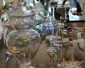 Assorted glass hurricane and lidded jars