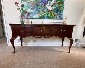Davis Cabinet Company mahogany huntboard/ sideboard with brass railing and drawer pulls. Measures 70"W x 19"D x 35"H