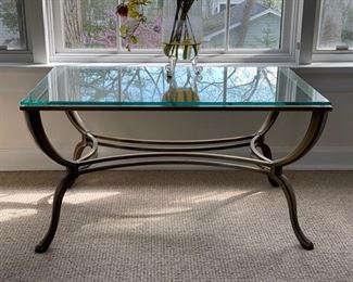 Glass-top cocktail table. Measures 34"L x 22"D x 19"H
