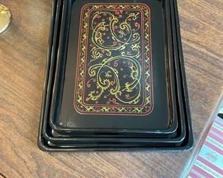 Set of three black enamel trays