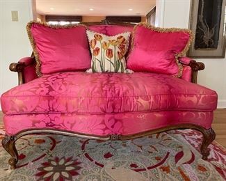 Two Francesca settees upholstered in pink silk fabric. Each measures 51"W x 41"H x 24"D. In excellent condition. Photo 1 of 3