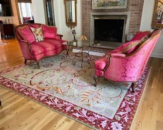 Custom area rug with pink and orange accents. Measures 8' x 10'. Photo 1 of 2