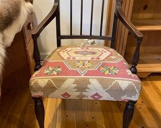 Vintage side chair upholstered in rug remnants.