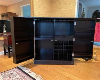 Crate & Barrel wine storage unit/bar on casters. Measures 36"W x 42"H x 22"D when closed. 72"W when fully open. Photo 2 of 2