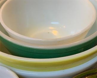 Yellow and green Pyrex bowls, set of white Pyrex bowls. 