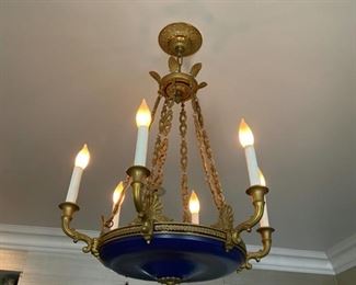 Antique bronze chandelier originally with candles.  Unusual  cobalt blue glass