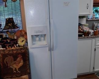 Whirlpool refrigerator/freezer with water/ice dispenser in door. Works well.