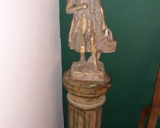 Roman column stand and statue.