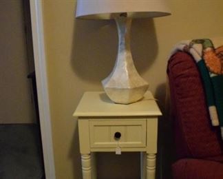 Side table and nice mother of pearl like lamp.