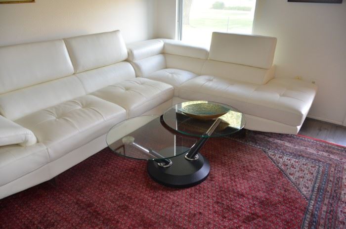 contemporary living room leather sectional and adjustable coffee table