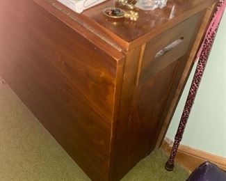 Drop leaf table with chairs stored inside