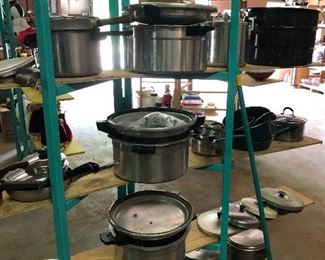 Various pots and pans, several pressure cookers 
