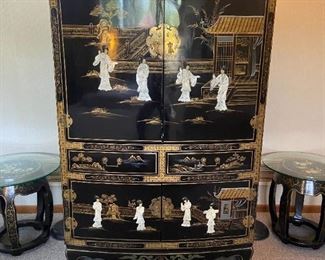 Asian lacquered cabinet with inlaid figures. Interior television storage and drawers below.  Matching barrel stools . Set of floor lamps also pictured.