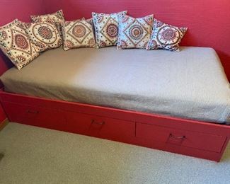 Single twin bed with mattress and storage.