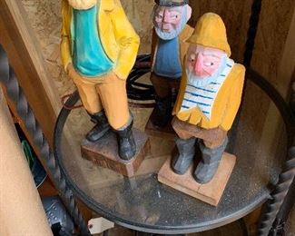 Carved wooden sailors and fishermen