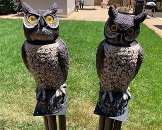 Solar powered garden owls with rotating heads and reflective eyes