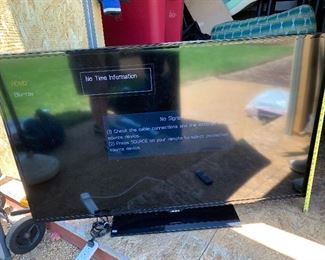 Two large, working Samsung TVs on stands