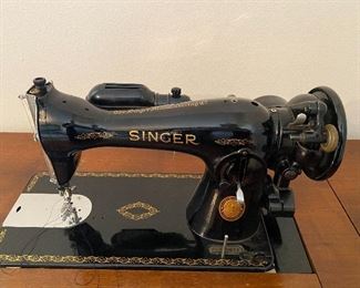 Singer Sewing machine, model # 15-91 
Serial # AL223622  Manufac. Dec 1952
Beautiful condition, new cabinet, and accessories.