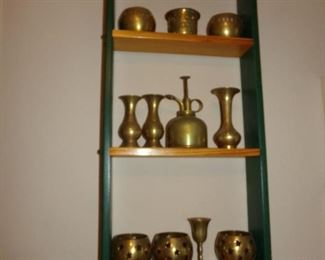 Brass Items in a Wall Shelf