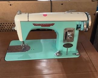 Modernage De Luxe Model 25 Made in Japan, aqua sewing machine in cabinet.  Cord has been cut.