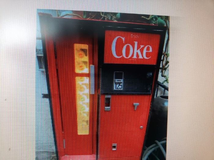 vintage coke machine: can load cans or bottles